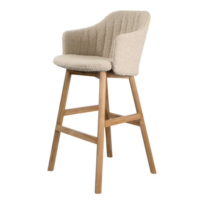 Beige textured bar stool with a curved back and light wood legs, perfect for modern decor.
