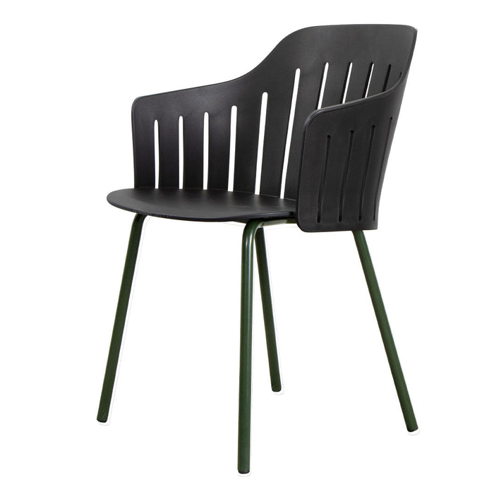 Black chair with a slatted design and green metal legs, perfect for modern decor. Sleek and stylish seating option.