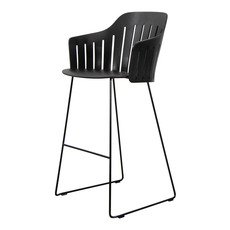 Black bar stool with slatted backrest and minimalist black metal legs for a modern aesthetic. Perfect for any decor.