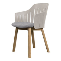 Modern chair with a light gray seat, white slatted backrest, and natural wood legs, combining minimalist design and neutral tones.