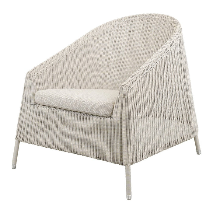 Neutral beige armchair with a textured woven pattern and a light cushion, ideal for modern decor.