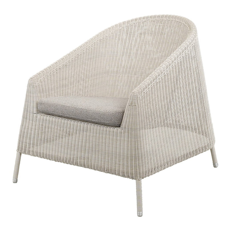 Light beige wicker chair with a smooth gray cushion, featuring a minimalistic and textured design.