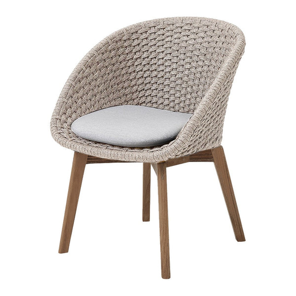 Beige woven chair with light grey cushion and natural wood legs, featuring a modern, stylish design.