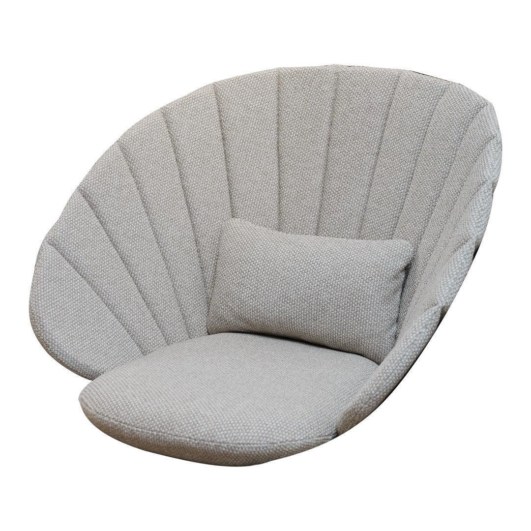 Soft gray oversized chair with unique shell-like design and vertical fabric panels. Includes a matching plush cushion.