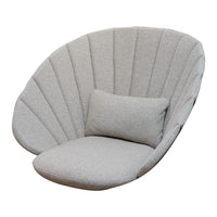 Soft gray oversized chair with unique shell-like design and vertical fabric panels. Includes a matching plush cushion.