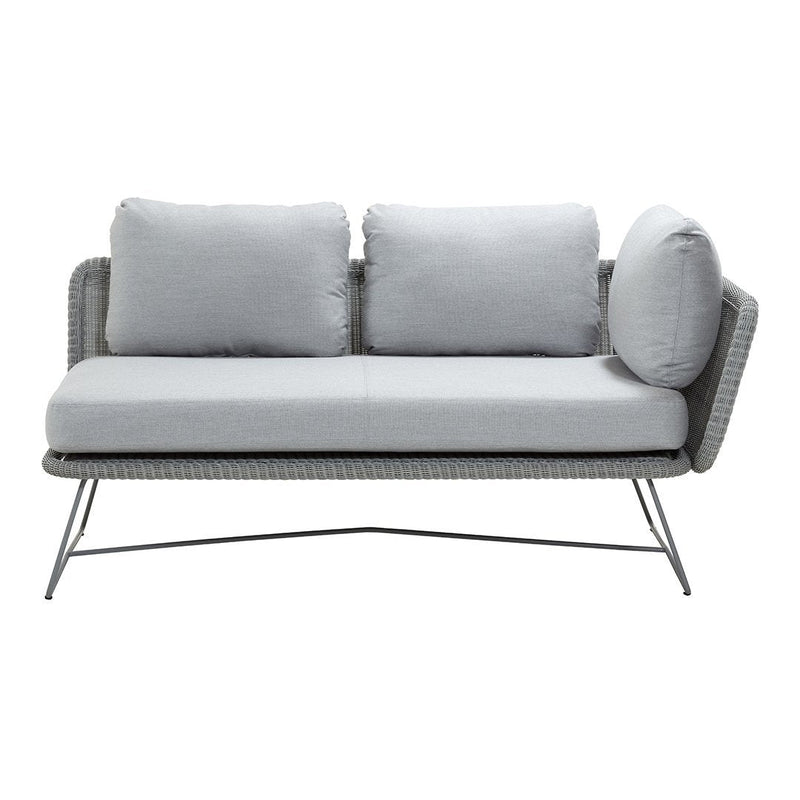 Light gray woven outdoor sofa with plush cushions and sleek metal frame. Modern design and neutral color palette.