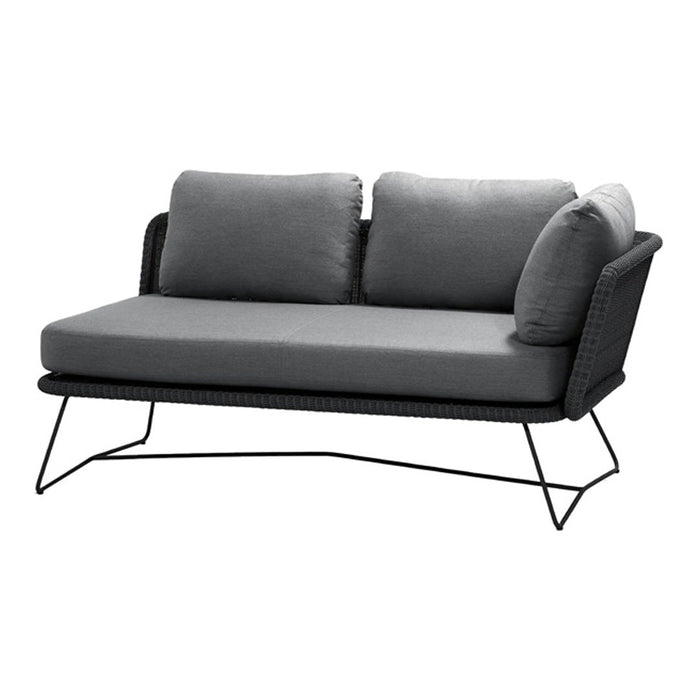 Gray two-seater sofa with plush cushions and a modern black wireframe. Elegant minimalist design perfect for any space.