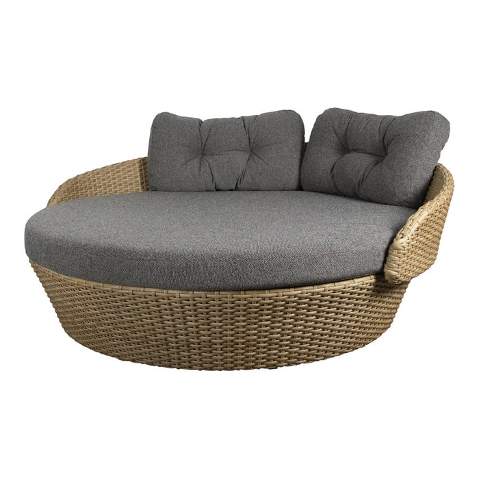 Round outdoor sofa with a textured wicker base and soft grey cushions, perfect for stylish patio decor.