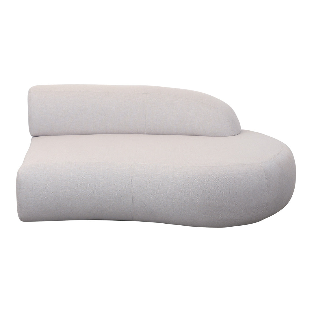 Curved cream sofa in smooth fabric with minimalist design and seamless edges for modern decor.