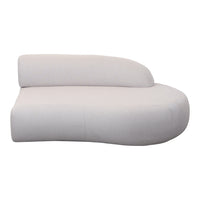 Curved cream sofa in smooth fabric with minimalist design and seamless edges for modern decor.