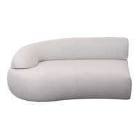 Curved light beige sofa with a smooth, minimalist design and no visible patterns. Ideal for modern interiors.