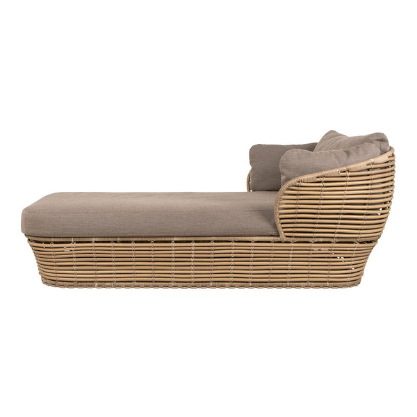Stylish rattan chaise lounge in natural beige tones with soft gray cushions, featuring a contemporary woven pattern.