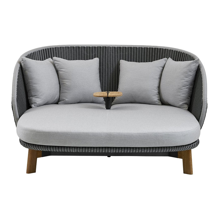 Gray and white striped sofa with plush gray cushions and wooden legs, featuring a built-in side table.
