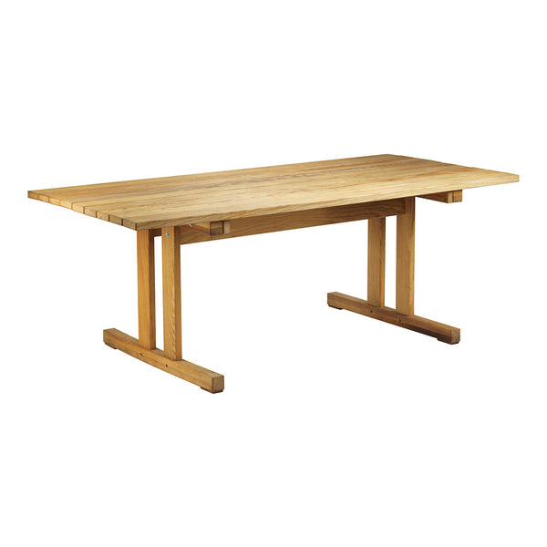 Natural wood dining table with a smooth finish and a clean, minimalist design. Perfect for modern interior spaces.