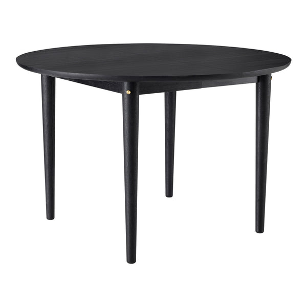 Round black table with smooth surface and sleek tapered legs, featuring a subtle golden accent. Perfect for modern decor.