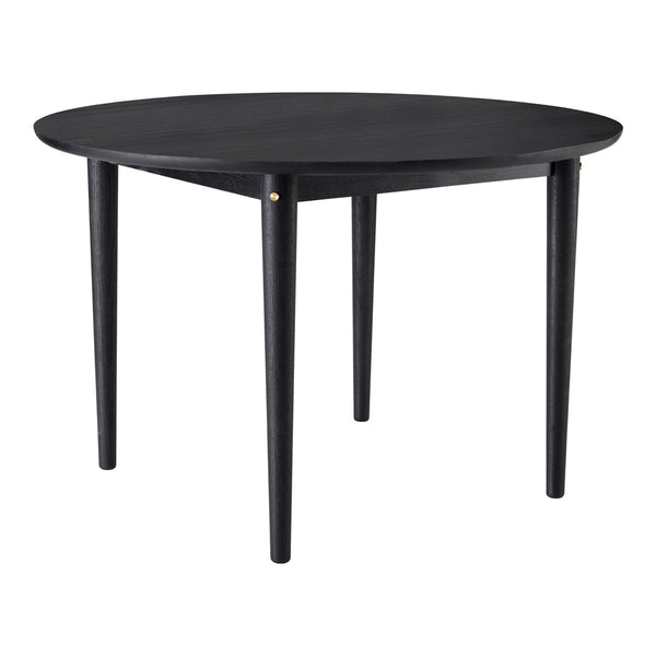 Round black table with sleek design, featuring a smooth surface and tapered legs for a modern look.