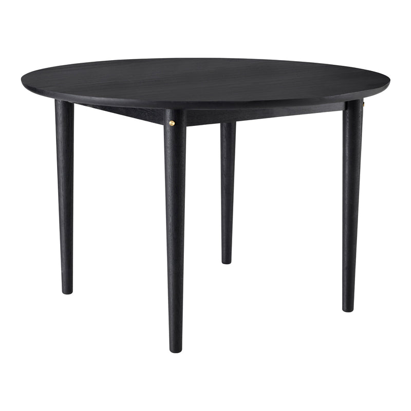 Round black table with sleek design, featuring a smooth surface and tapered legs for a modern look.