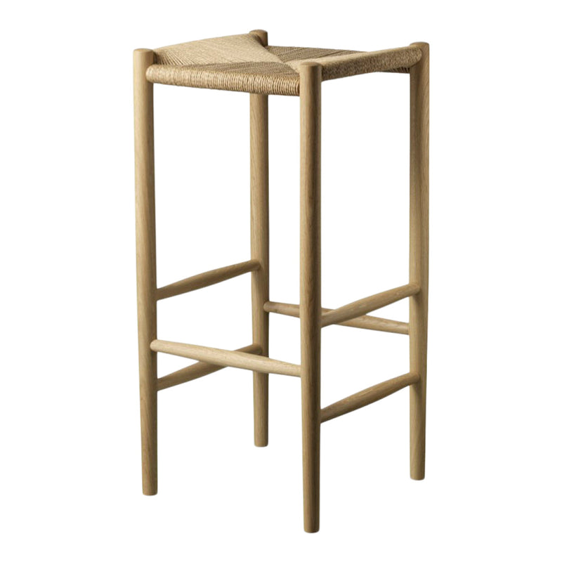 Natural wooden bar stool with a woven straw seat, showcasing a minimalist design and earthy, neutral tones.