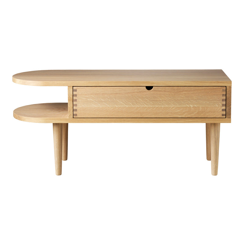 Light oak coffee table with a unique curved design and a single drawer, showcasing natural wood grain patterns.