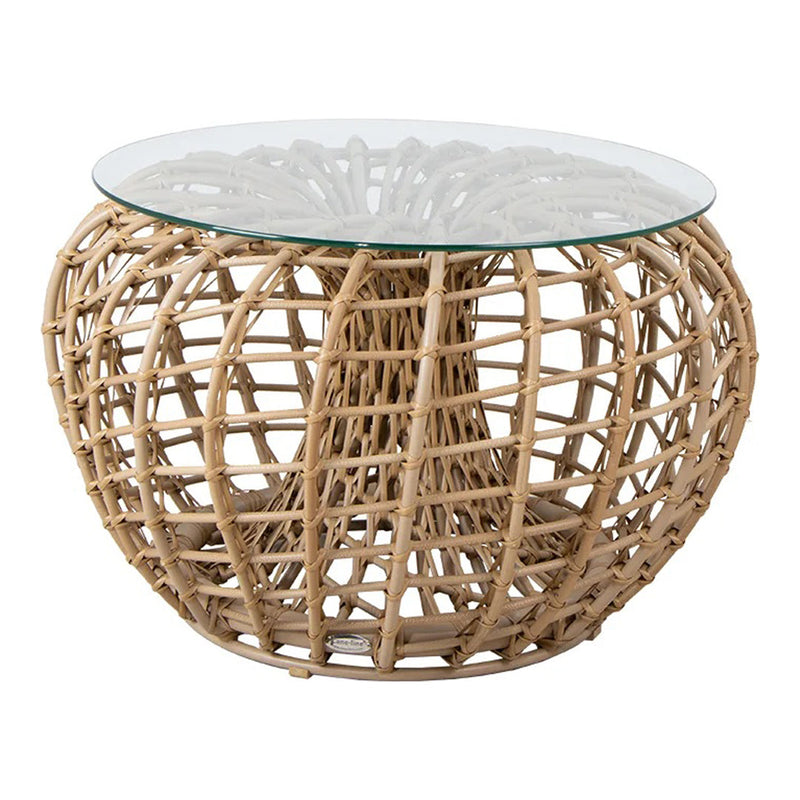 Natural rattan woven table base with a clear glass top, showcasing a stylish, organic pattern in beige tones.