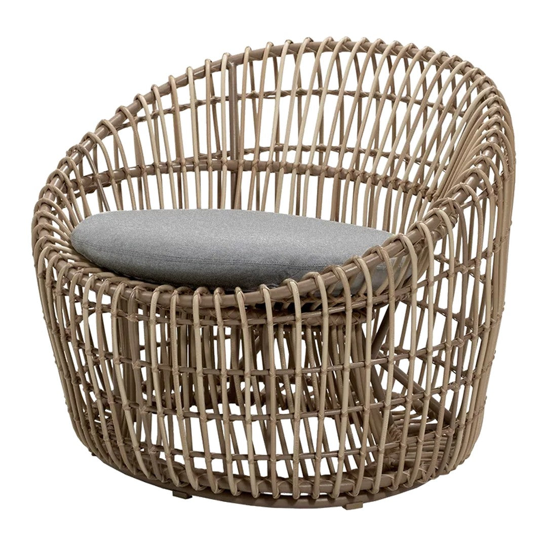 Natural woven rattan chair with a light tan finish and a soft gray cushion, featuring an open lattice design.
