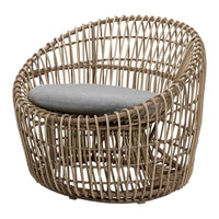 Natural woven rattan chair with a light tan finish and a soft gray cushion, featuring an open lattice design.