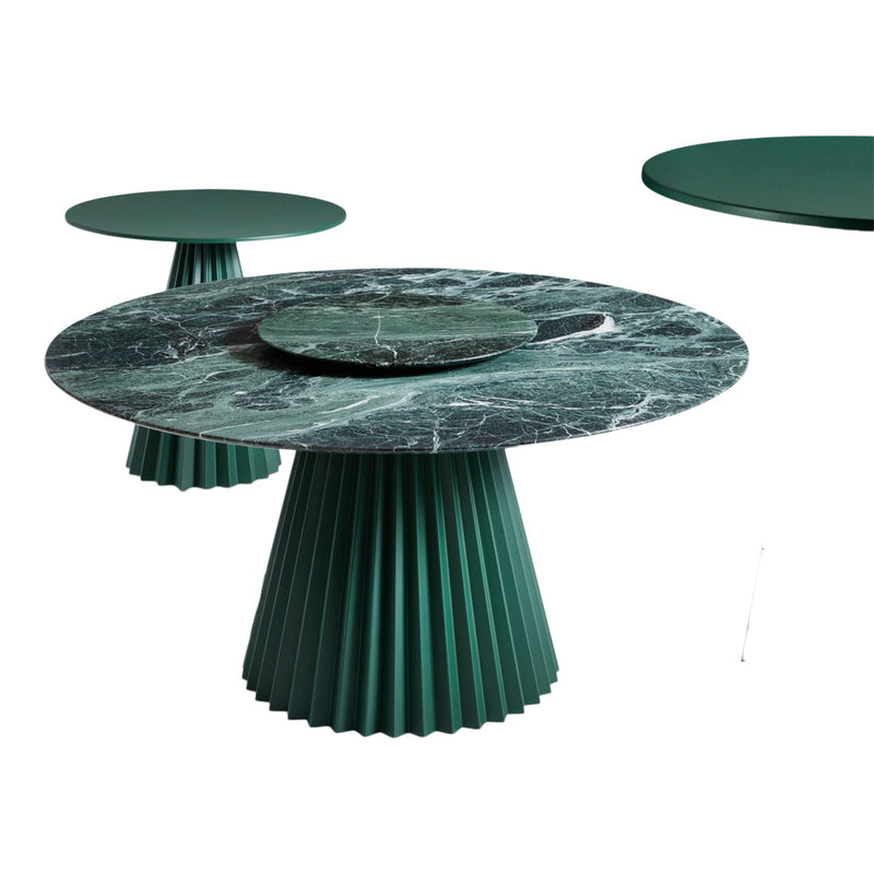 Green marble tabletop with a fluted base, featuring dark green and black veining patterns. Contemporary design.