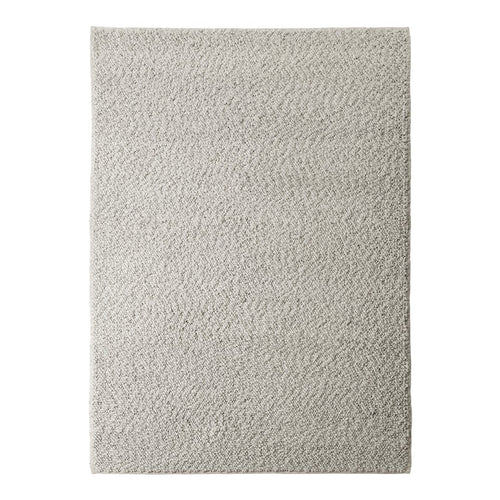 Gray textured rug with a subtle wave pattern, perfect for adding elegance to any space.