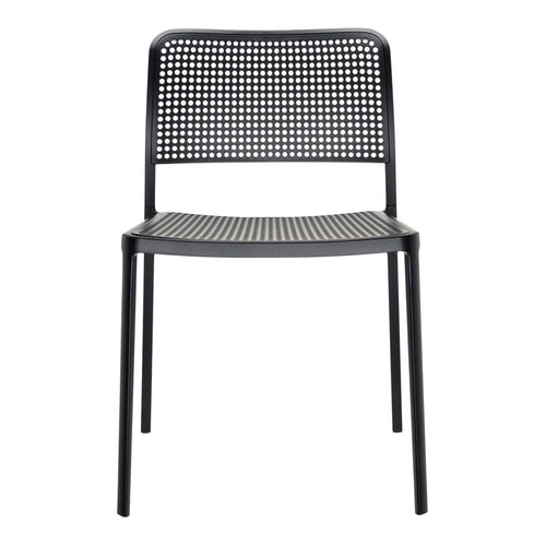 Black perforated dining chair with a sleek, minimalist design and a modern finish. Ideal for contemporary spaces.