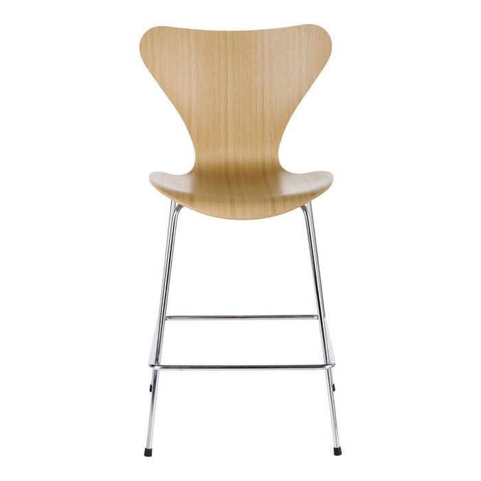 Natural wood finish with smooth, curvy lines and sleek chrome legs for a modern look. Ideal for contemporary spaces.
