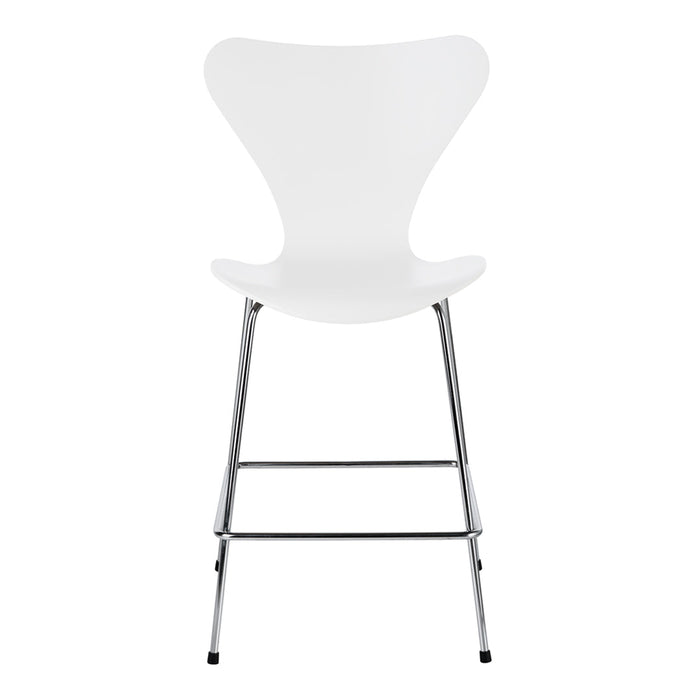 White chair with a sleek, curved design and chrome legs, featuring a minimalist aesthetic perfect for modern decor.