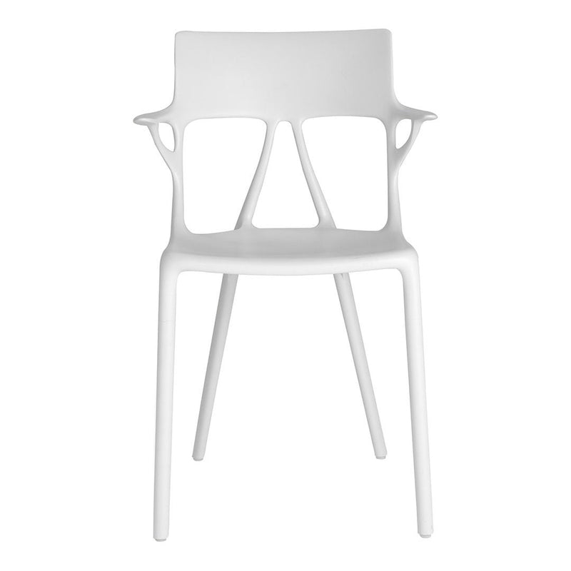 White plastic chair with a minimalist design and smooth, clean lines. Perfect for modern decor.