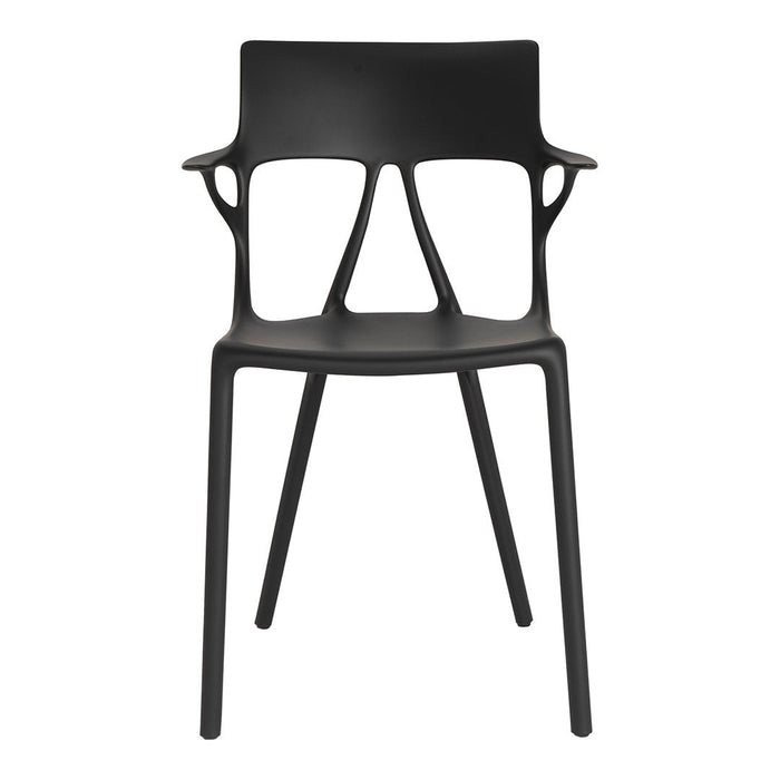 Black modern chair with a minimalist design, featuring smooth lines and a unique back pattern. Perfect for contemporary spaces.