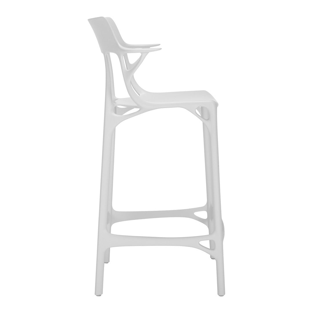Sleek white bar stool with a modern design, featuring a smooth finish and unique contoured patterns.