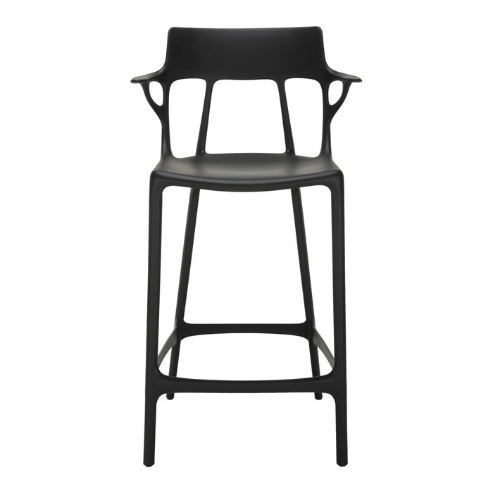 Sleek black bar stool with a modern design featuring smooth curves and a minimalist silhouette. Perfect for any decor.