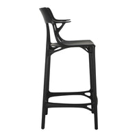 Black bar stool with a sleek, modern design and unique cut-out patterns. Ideal for contemporary decor.