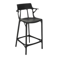Black modern bar stool with a sleek, minimalist design and unique cut-out patterns. Perfect for contemporary spaces.