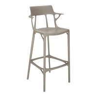 Stylish bar stool in soft taupe with modern cut-out design and sleek high legs. Perfect for contemporary spaces.