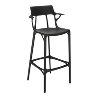 Black modern bar stool with a sleek, minimalist design and organic patterns in the backrest. Perfect for contemporary spaces.