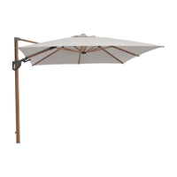 White cantilever patio umbrella with a wooden frame and a sleek black base. Stylish, modern design for outdoor use.