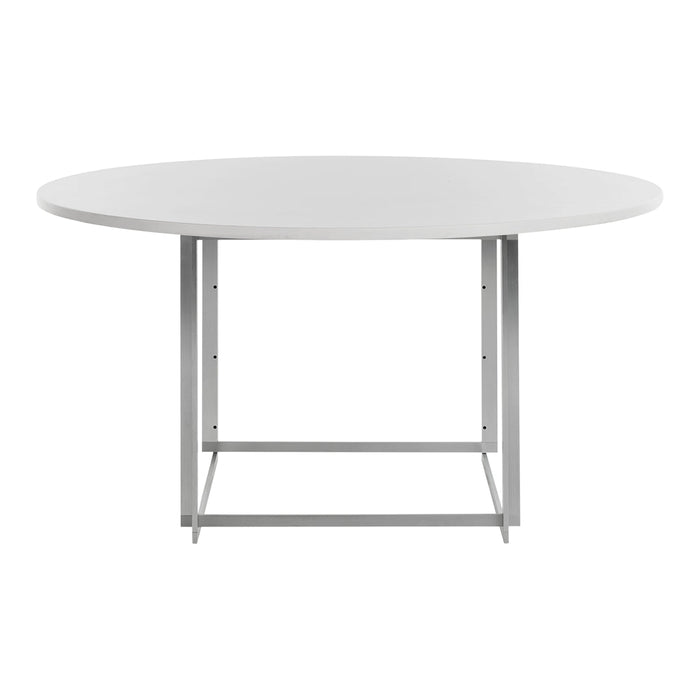 Round white dining table with a sleek silver metal frame. Minimalist design for modern interiors.