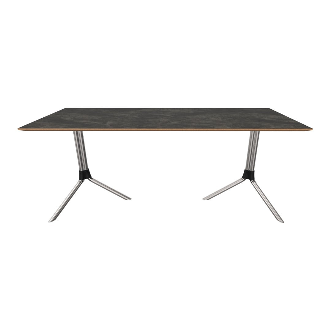 Modern rectangular table with a dark gray surface and sleek metallic legs, featuring a minimalist aesthetic.