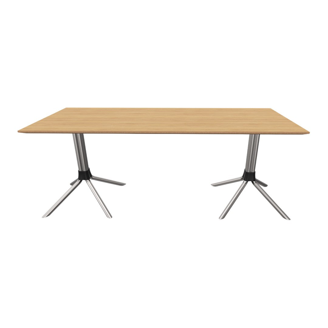 Light oak tabletop with a smooth finish and sleek silver legs, perfect for modern interiors.