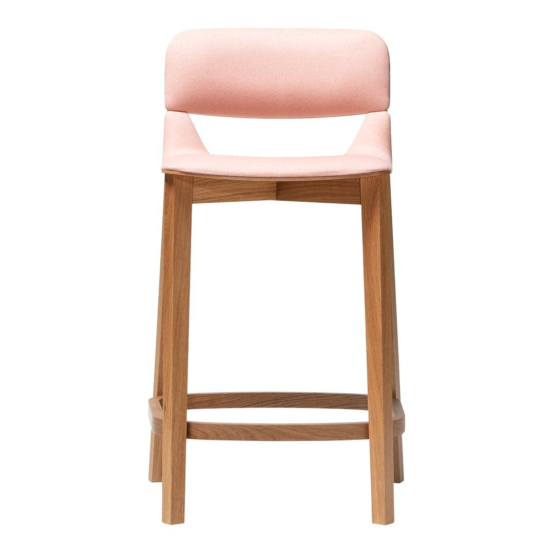 Stylish pink upholstered bar stool with a natural wood frame, perfect for modern home décor.