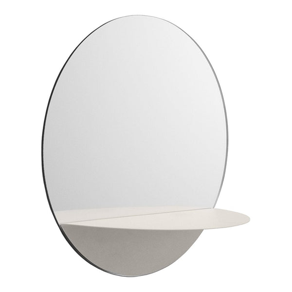 Oval mirror with a sleek black frame and a minimalist white shelf, featuring smooth, reflective surfaces.