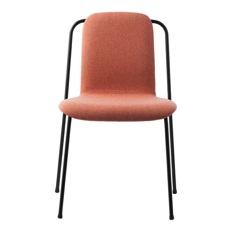 "Modern chair in soft terracotta fabric with sleek black metal legs and minimalist design."