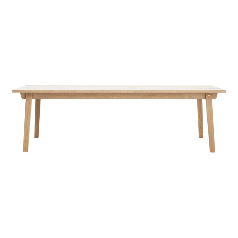 Light wood dining table with a smooth, natural finish and minimalist design, perfect for modern interiors.