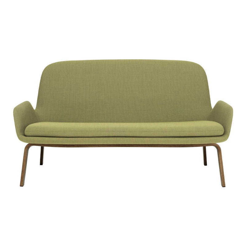 Green mid-century modern sofa with a smooth, textured fabric and sleek wooden legs. Ideal for stylish living spaces.