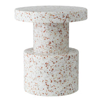 White terrazzo table with subtle speckles in warm tones of orange and brown, featuring a modern geometric design.