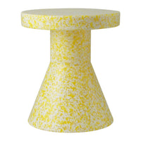 Yellow speckled cone-shaped side table with a round top and textured finish, adding a vibrant touch to any room.